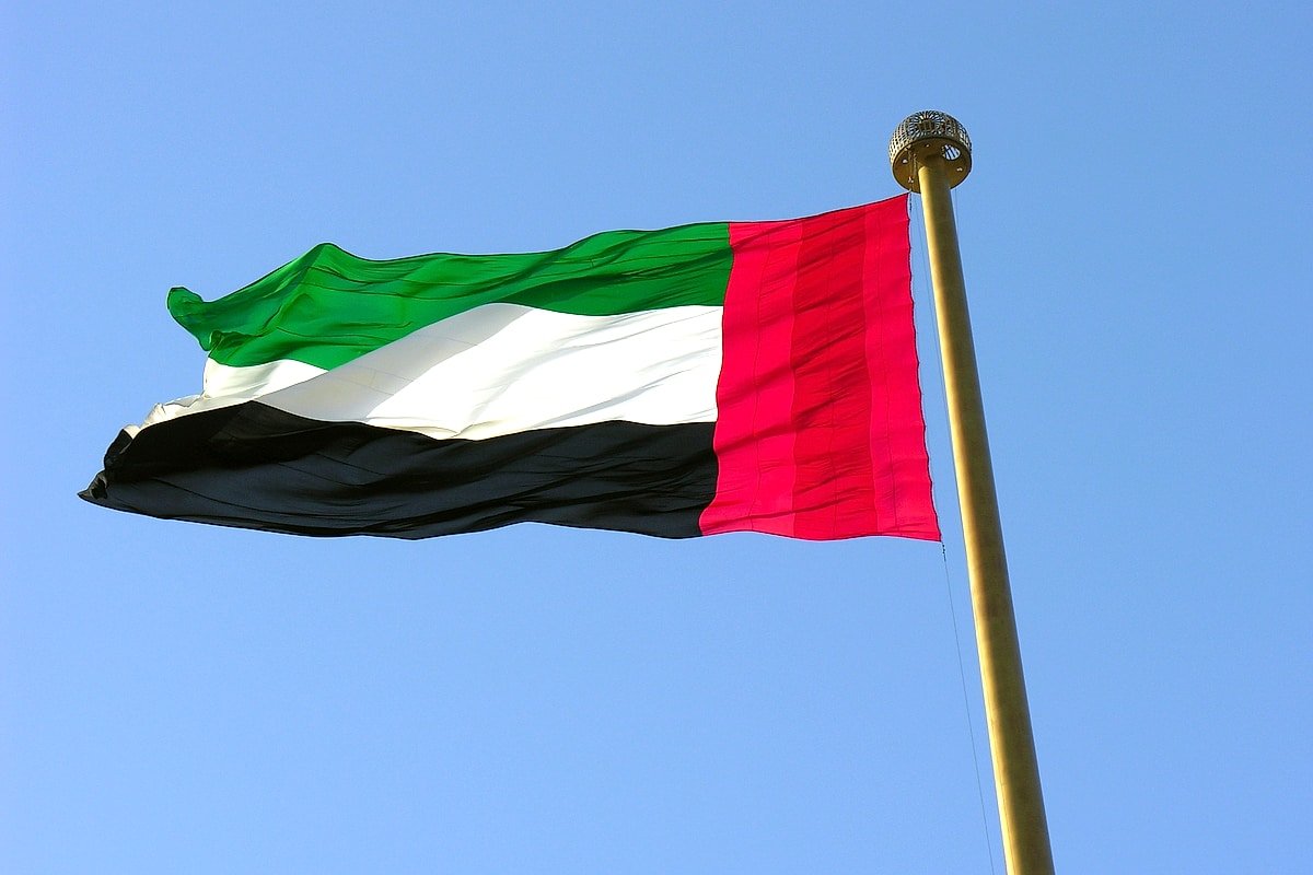 UAE Union Pledge Day represented by the national flag flying against a clear blue sky