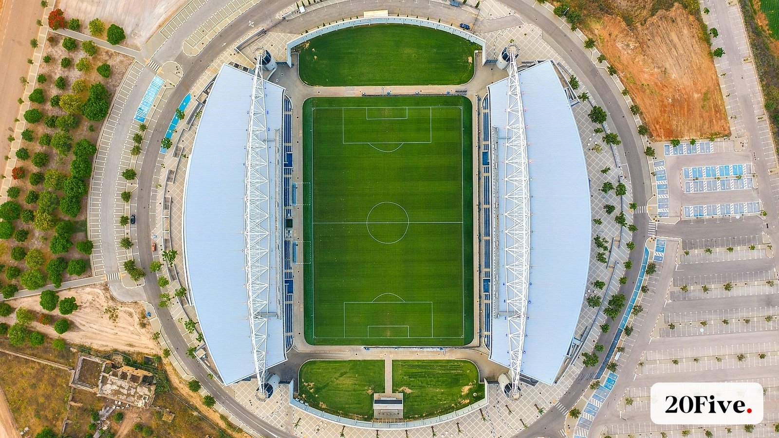 A bright aerial stadium view illustrating the reported search for Aramco Stadium investors