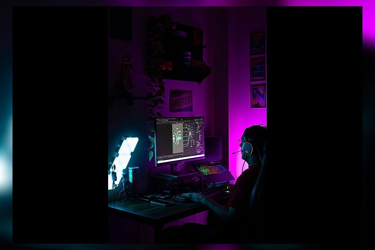 A player at a colourful gaming station illustrating the PIF Electronic Arts deal