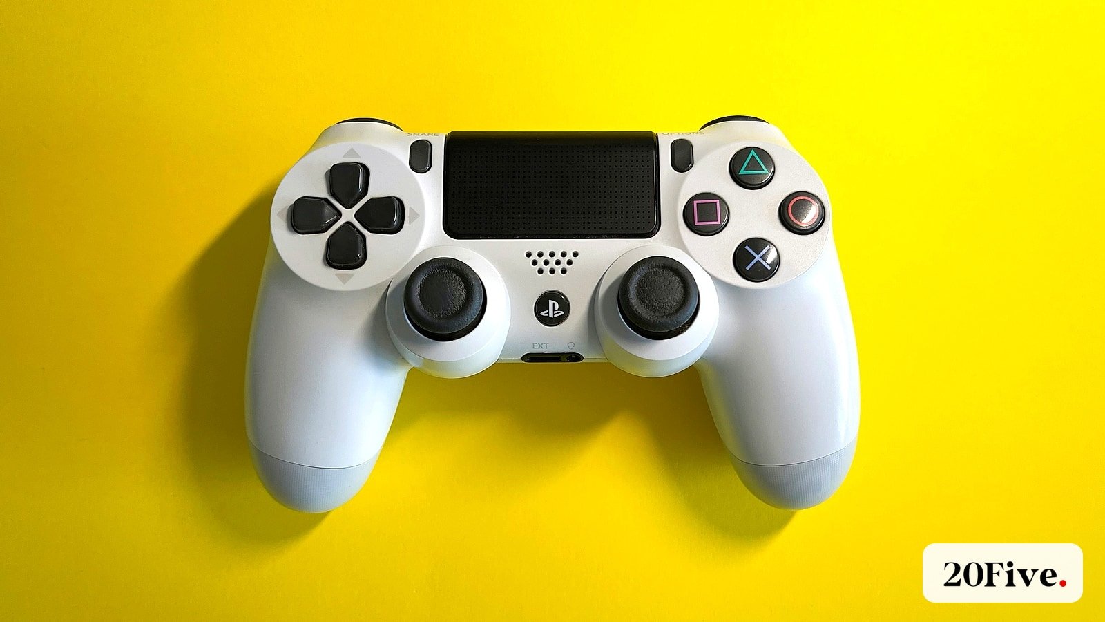 A white game controller on a bright yellow background representing the PIF Electronic Arts deal